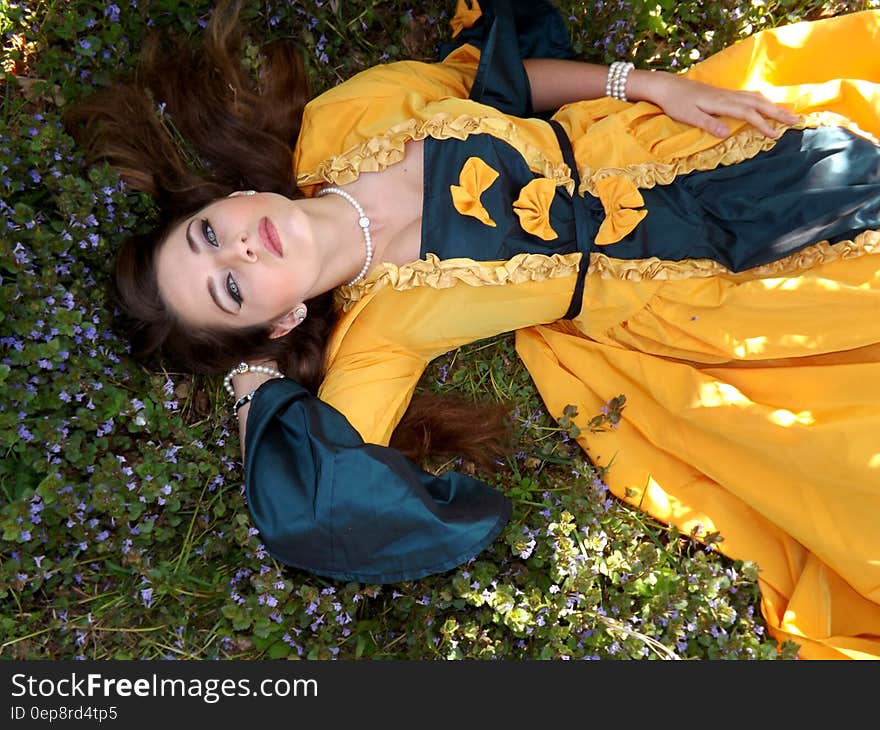 Yellow Dressed Woman on Green Leafed Plant