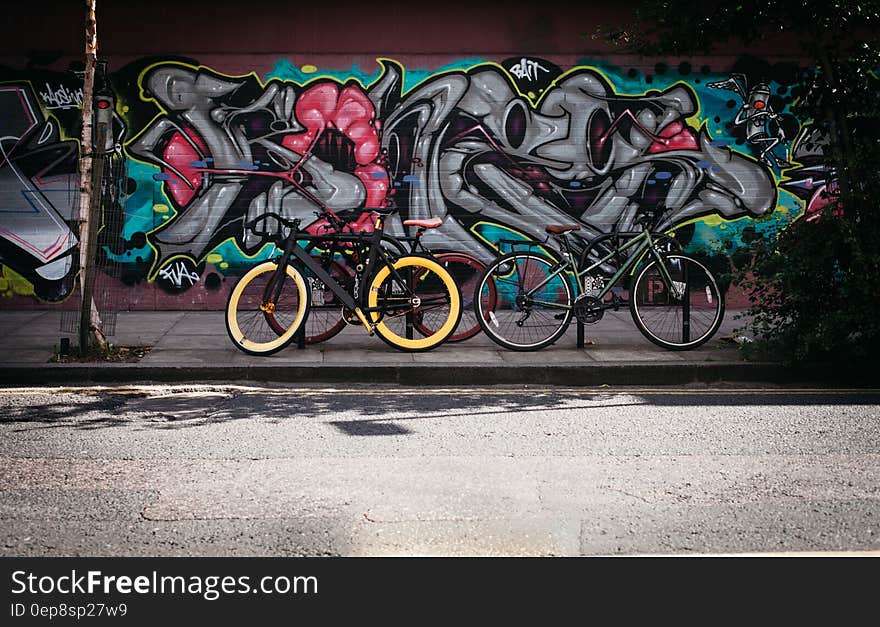 Black and Yellow Fatbike Beside Mountain Bikes