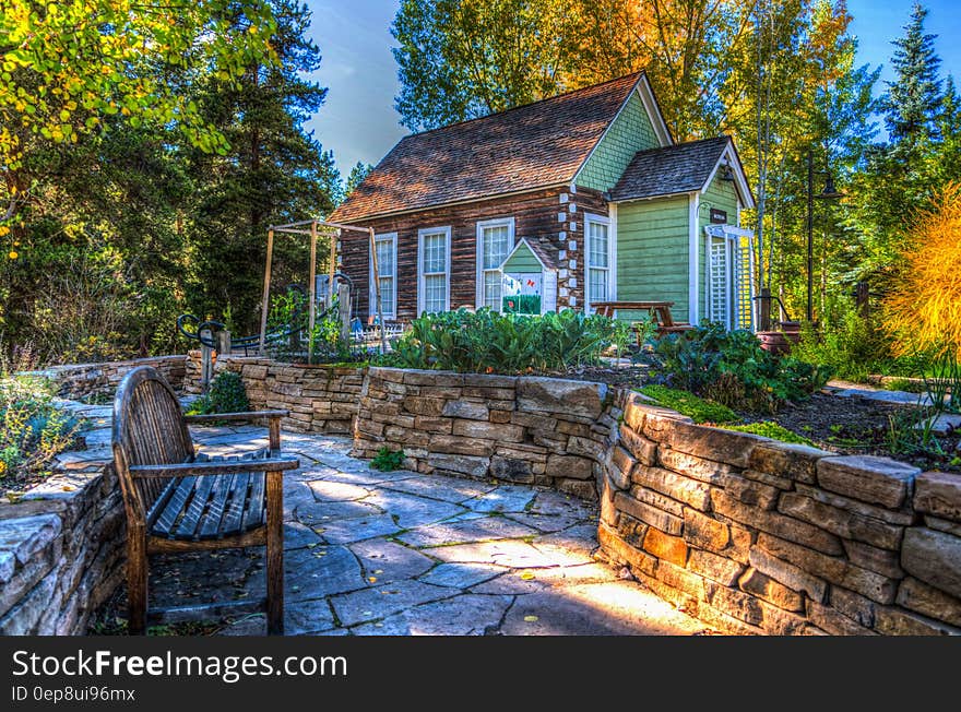 Brown and White Wooden House on Green Forest