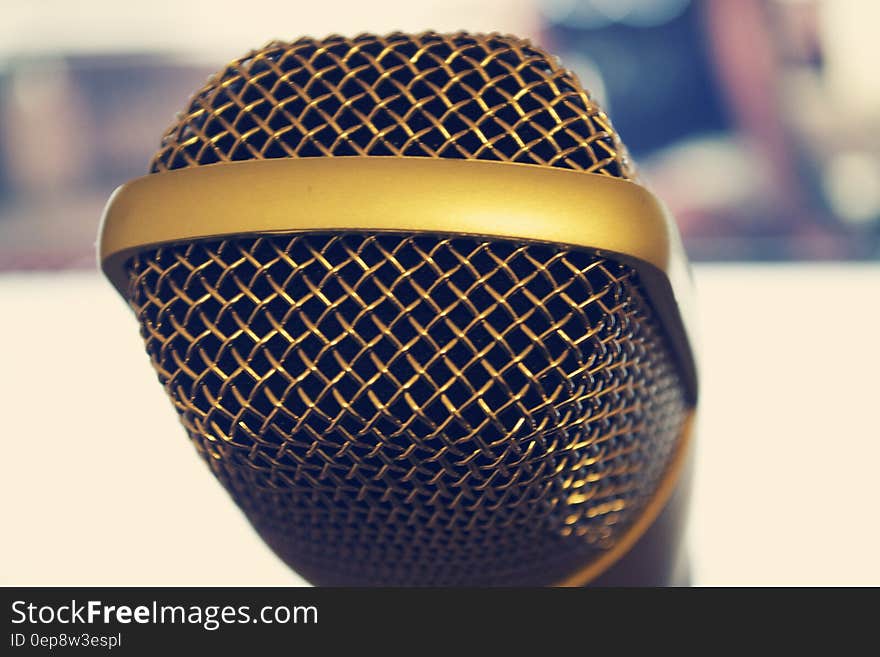 A close up of a microphone on a stand. A close up of a microphone on a stand.