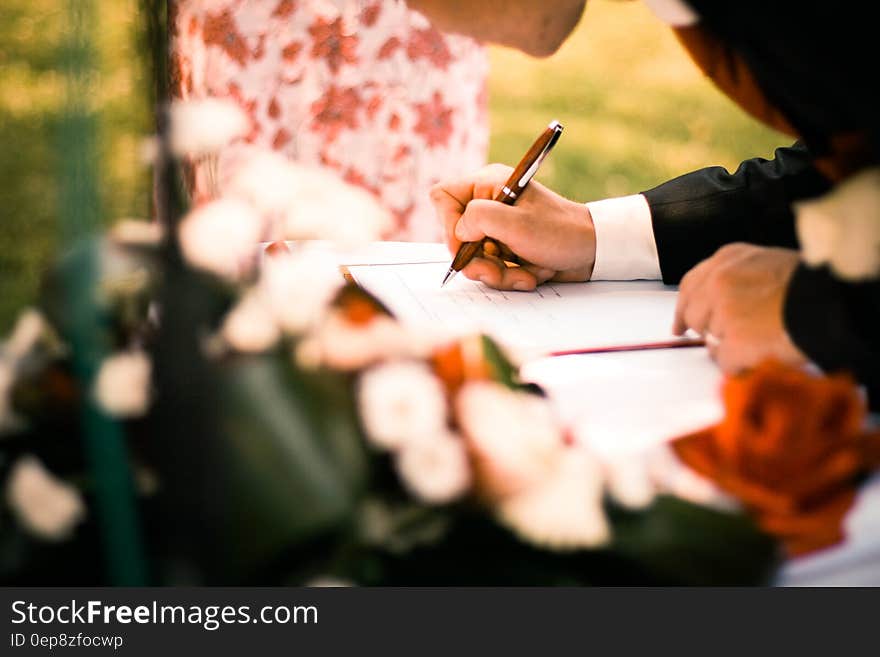 Person Drawing on White Paper