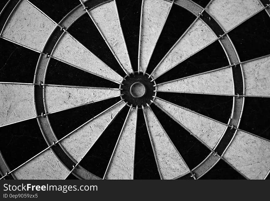 Close up of dart board in black and white.