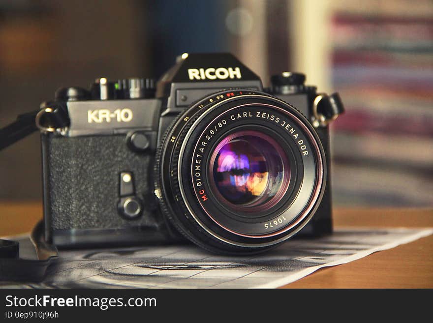 Vintage Ricoh KR-10 camera on tabletop. Vintage Ricoh KR-10 camera on tabletop.