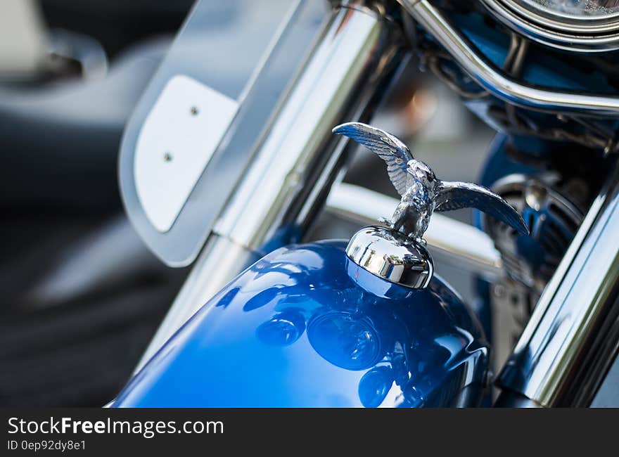 Harley Davidson Emblem on Top Front of Blue Motorcycle