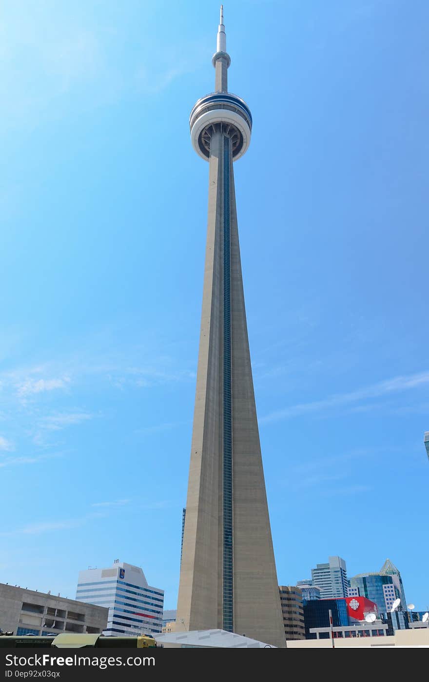 CNN Tower in Toronto, Canada skyline against blue skies on sunny day. CNN Tower in Toronto, Canada skyline against blue skies on sunny day.