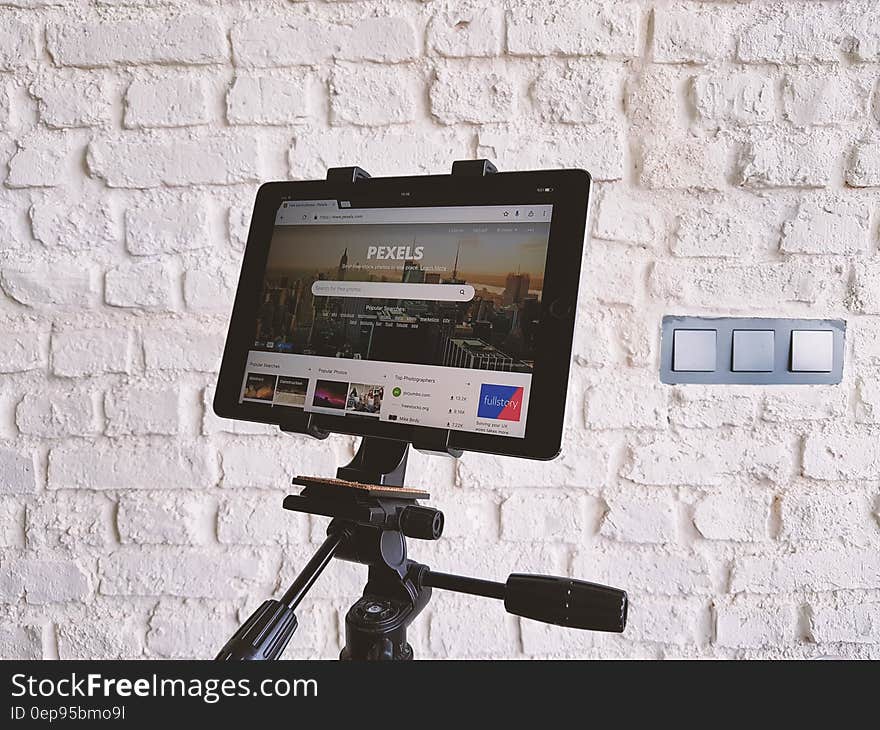 Black Tablet Computer Showing Pexels Webpage