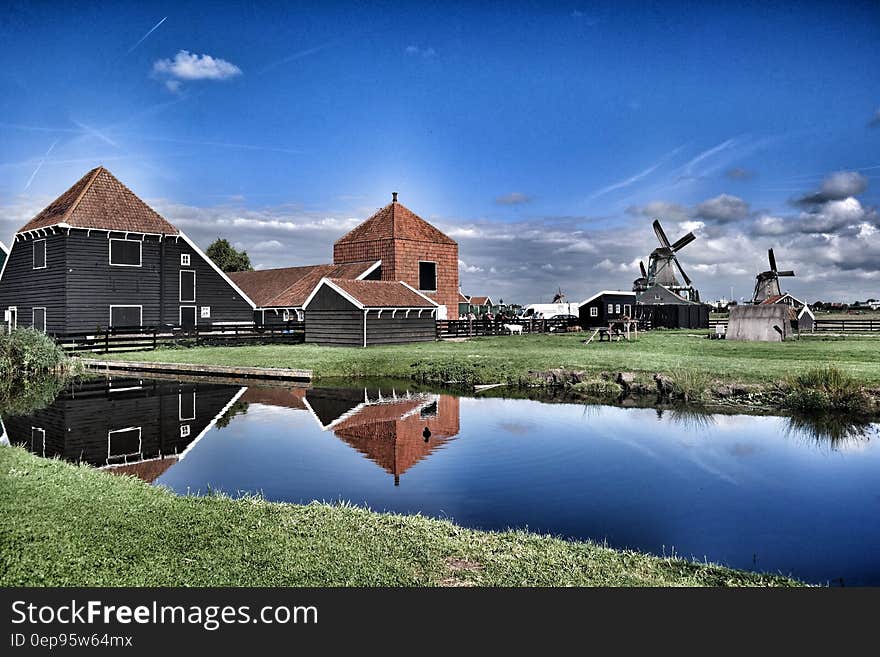 Brown Grey Barn House Near Windmill during Daytime