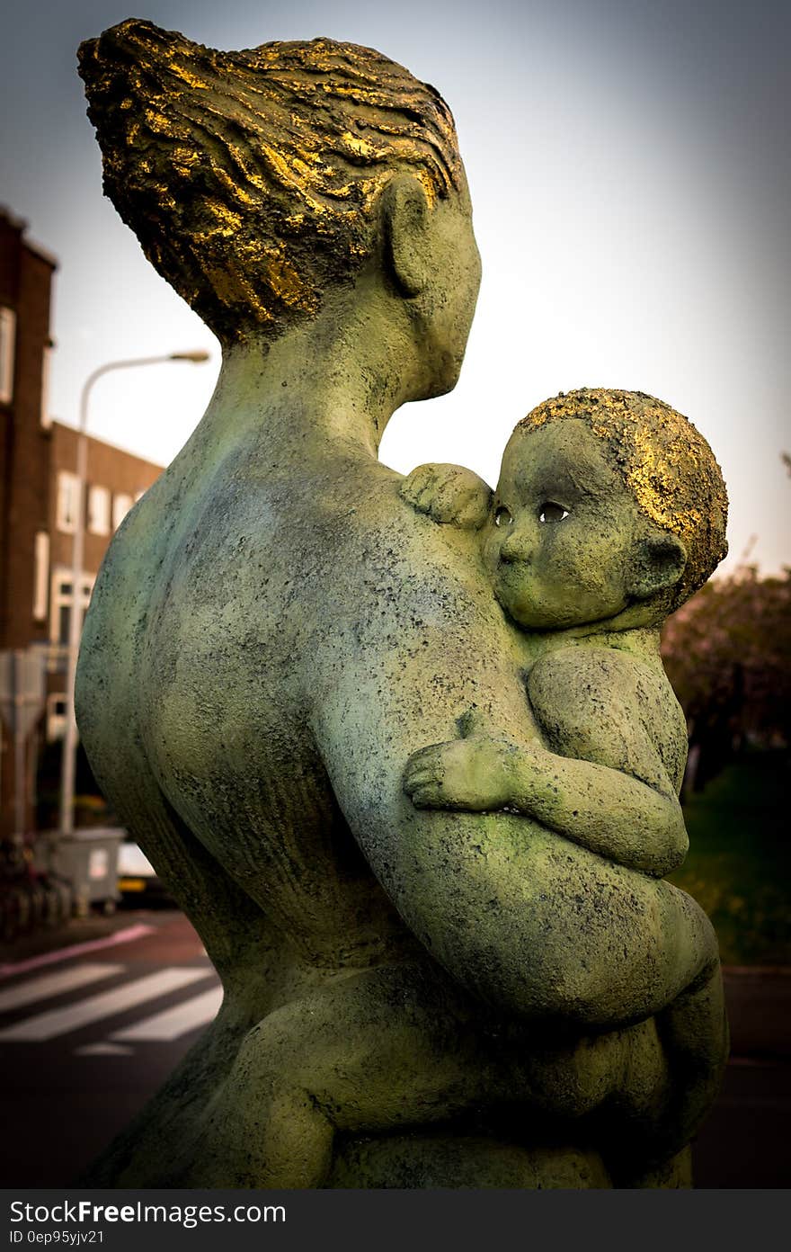 Statue of a mother holding her child. Statue of a mother holding her child.