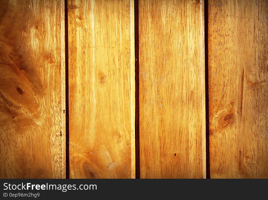 Closeup of light wood paneling.