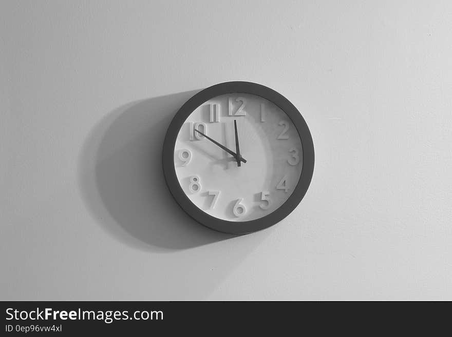 Black and white clock on the wall.