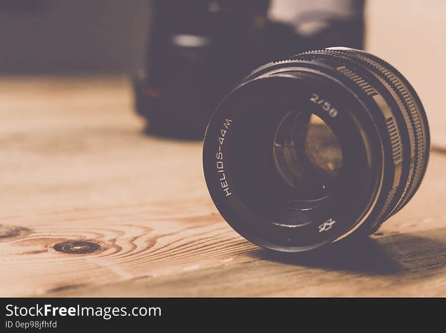 Black Helios 44m 2/58 Camera Lens on Brown Wooden Table