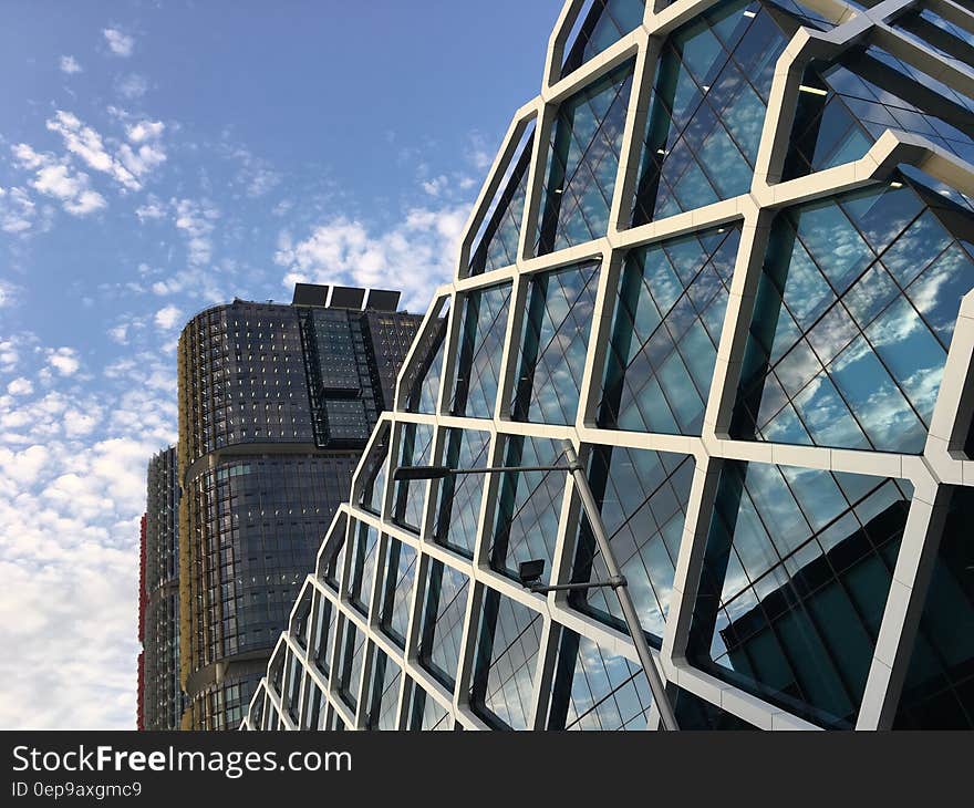 White Frame Glass High Rise Building Under Clear Blue Sky