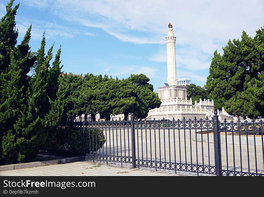 White Tower Under Blue and White Sky