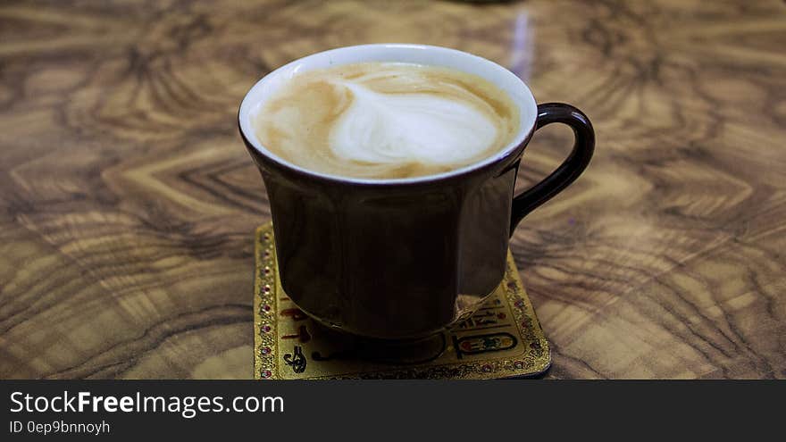 Cappuccino on Black Ceramic Mug