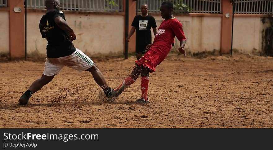 2 Soccer Player Playing for a Ball