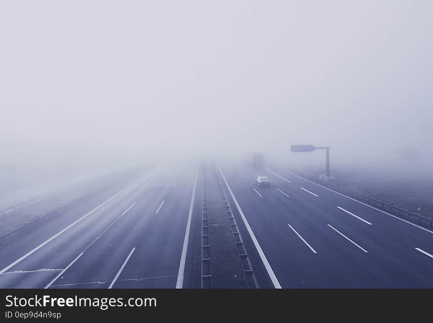 Black Car on Hi-way With Fog