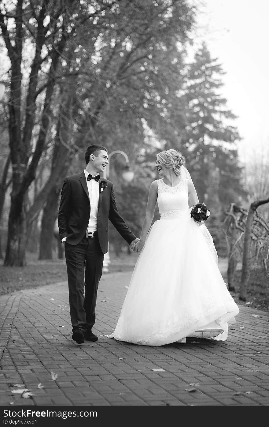 Woman and Man Walking at Park