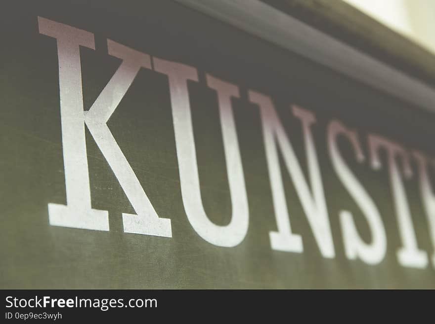 Close up of letters spelling Kunst on banner indoors. Close up of letters spelling Kunst on banner indoors.