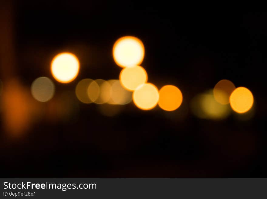 Abstract background blur of bokeh lights at night.