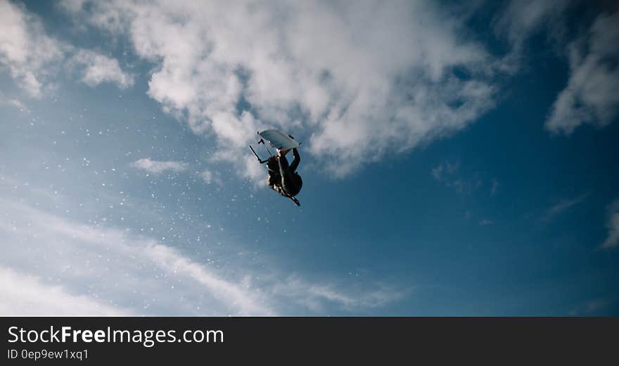 Low Angle Photo of Wakeboarder in the Sky