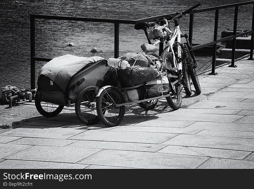 Bicycles on Anroad Next to Water