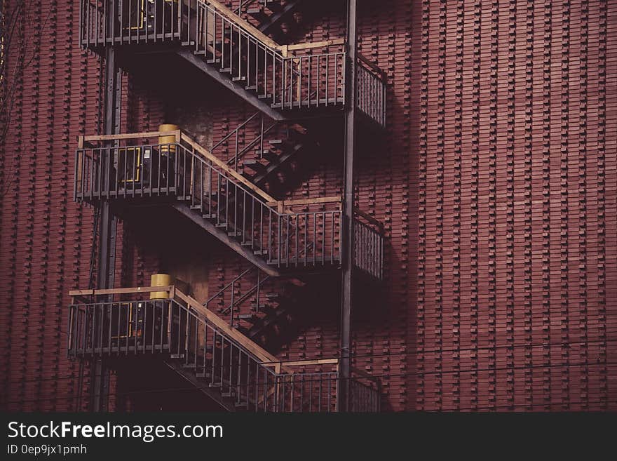 Metal fire escape outside modern building. Metal fire escape outside modern building.