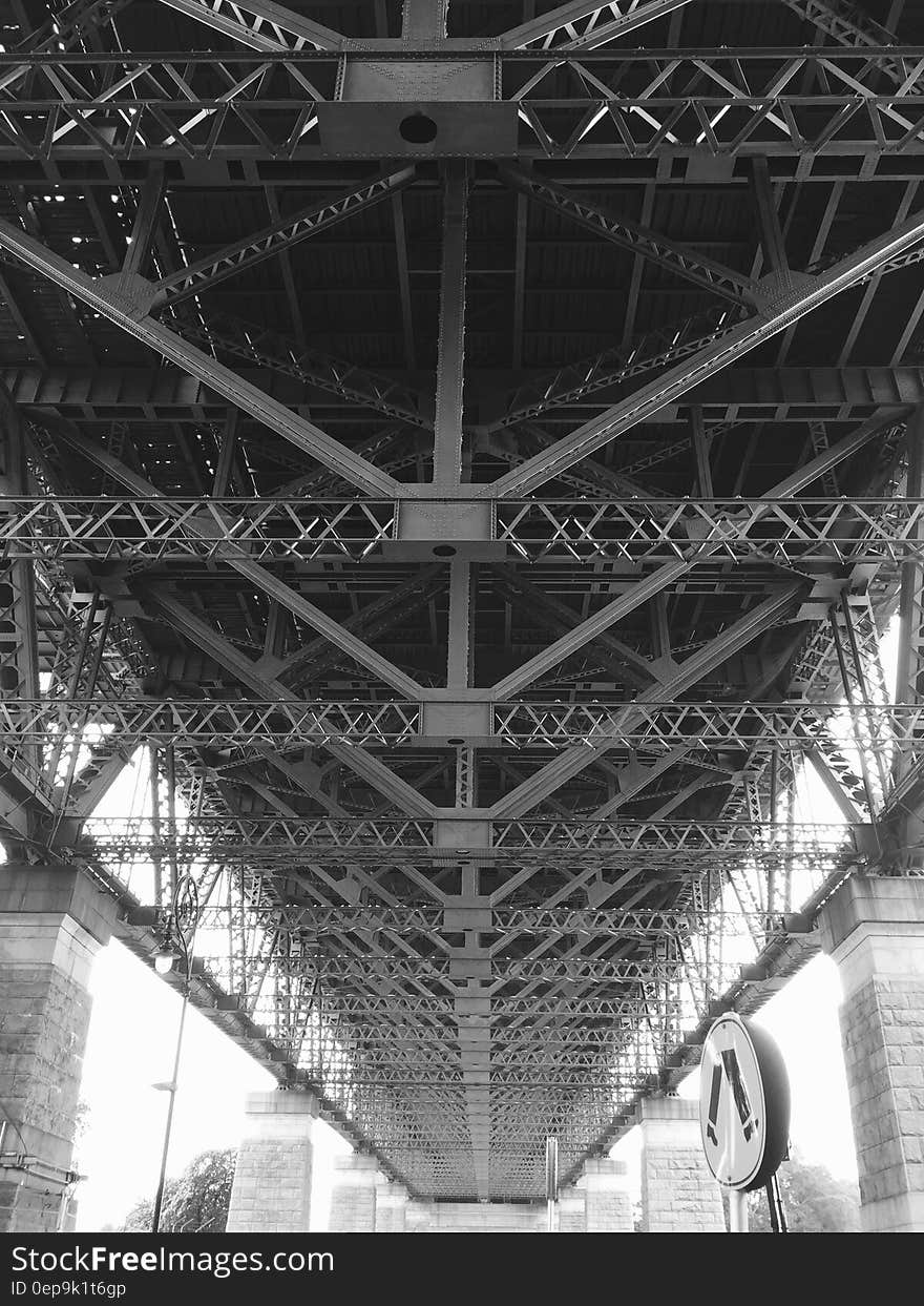 Grayscale Photo of Bridge Frame