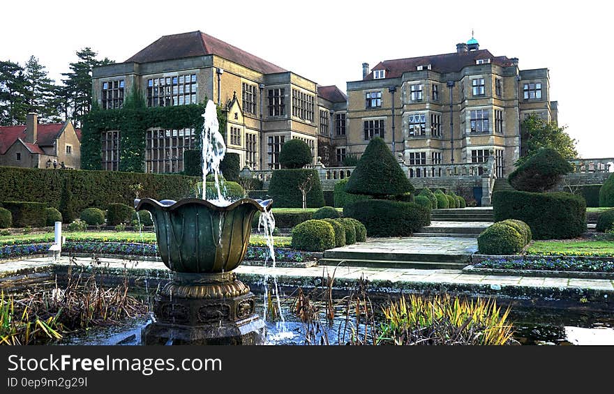 Fountain on grounds of country estate on sunny day. Fountain on grounds of country estate on sunny day.