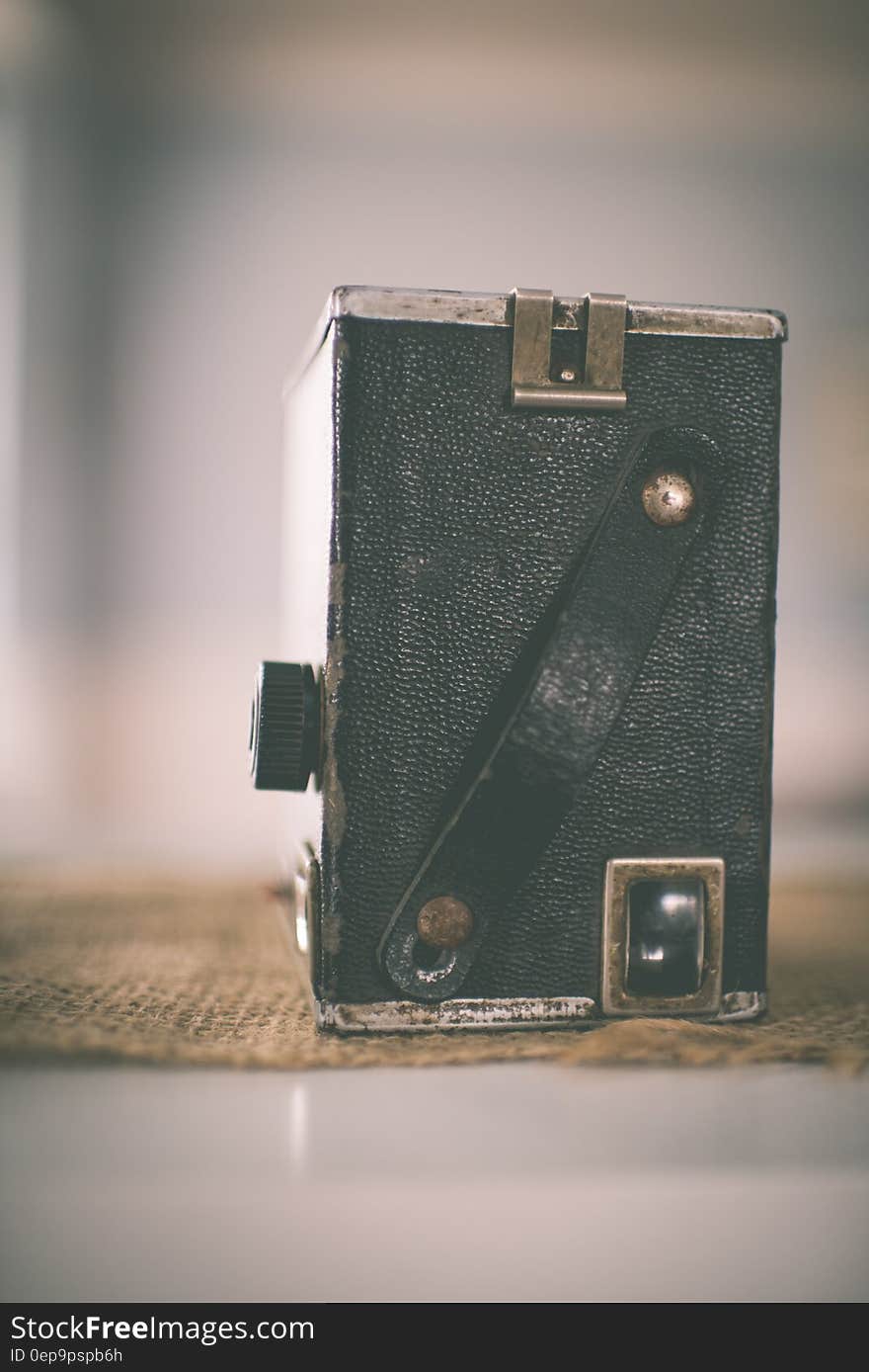 Back of vintage black camera on burlap. Back of vintage black camera on burlap.