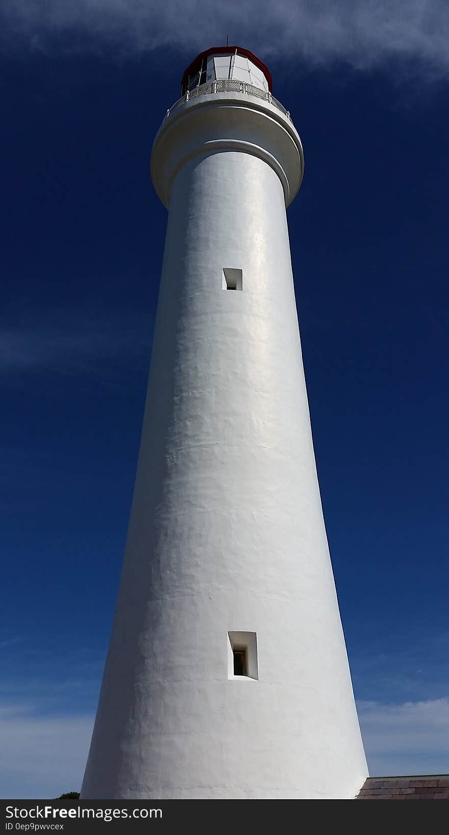 White Lighthouse in Low Angle Photography