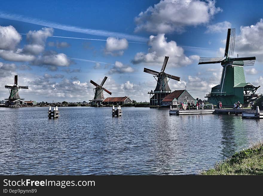 Wooden Windmills Near Lake