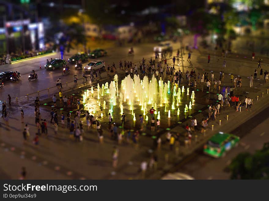 Fountain Surrounded by People during Nighttime