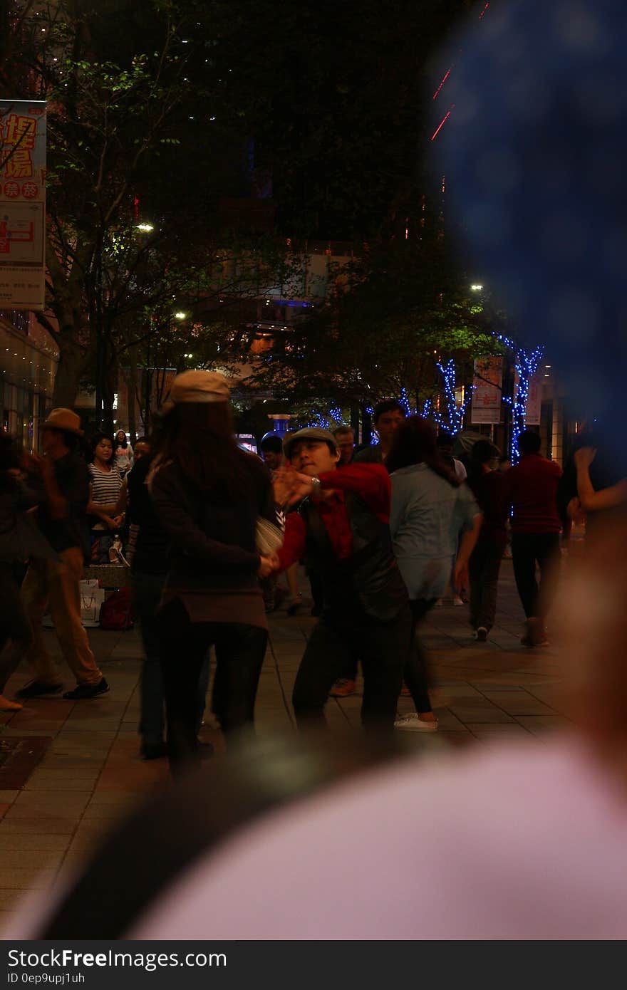 Couples dancing in the street in the evening. Couples dancing in the street in the evening.