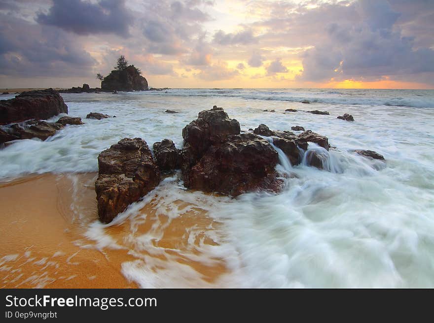 View of Sea Against Cloudy Sky during Sunset