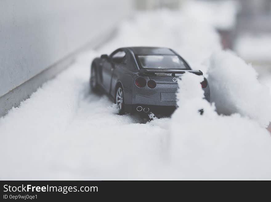 Close-up Photo of Toy Car on Snow