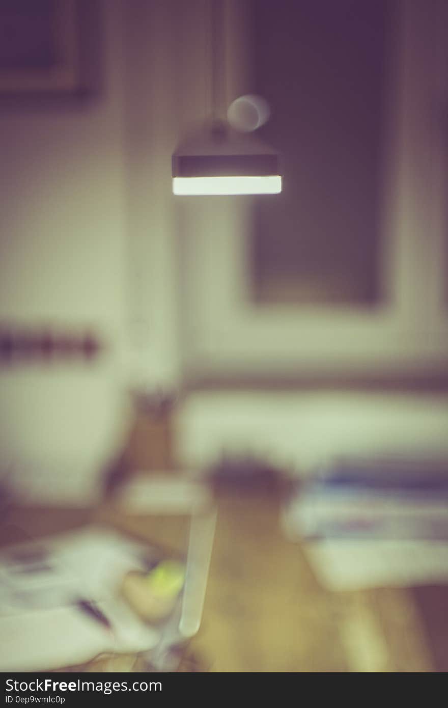 Blurred interior office room with furnishings and lamp. Blurred interior office room with furnishings and lamp.