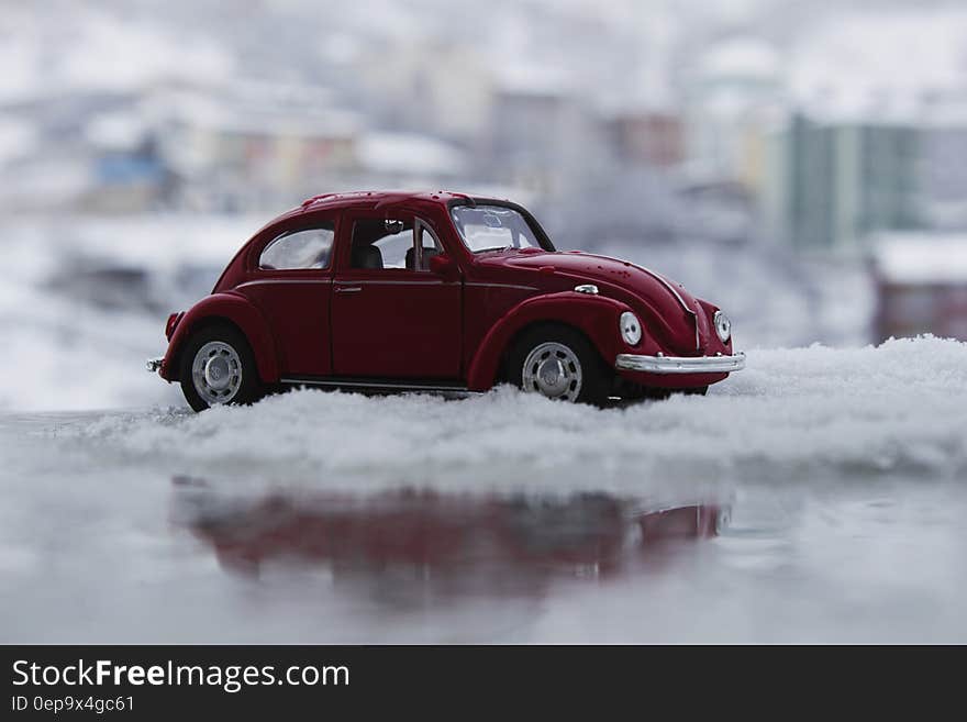 Red Toy Car in Snow