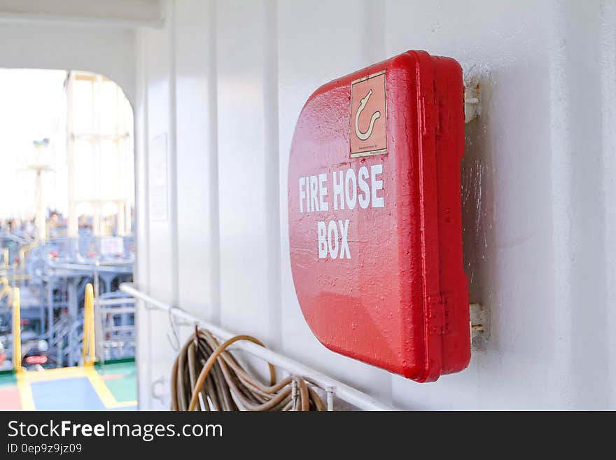 Close up of fire hose box mounted on wall.