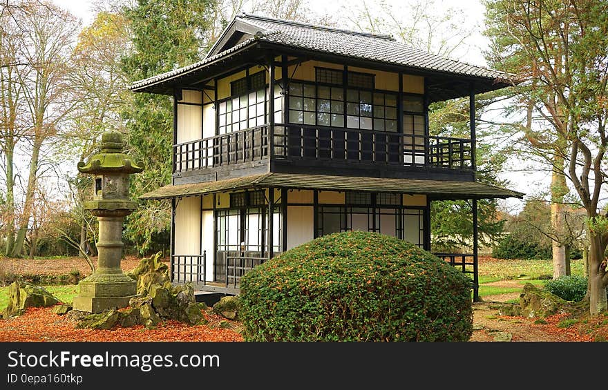 Exterior of small pagoda in Japanese garden on sunny day. Exterior of small pagoda in Japanese garden on sunny day.