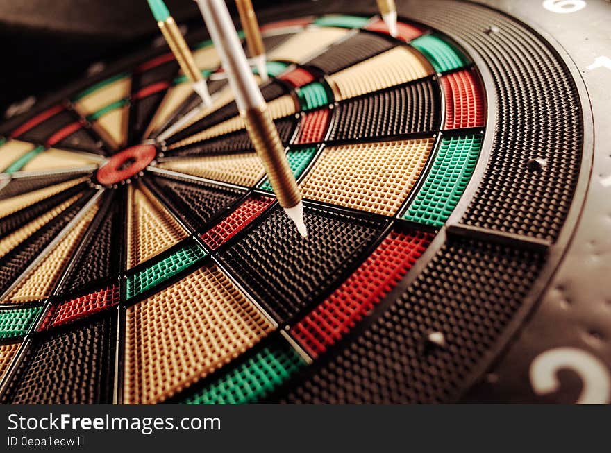 Darts in segments on close up of dartboard. Darts in segments on close up of dartboard.