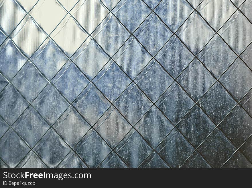 Abstract blue and white tiled surface with square pattern. Abstract blue and white tiled surface with square pattern.