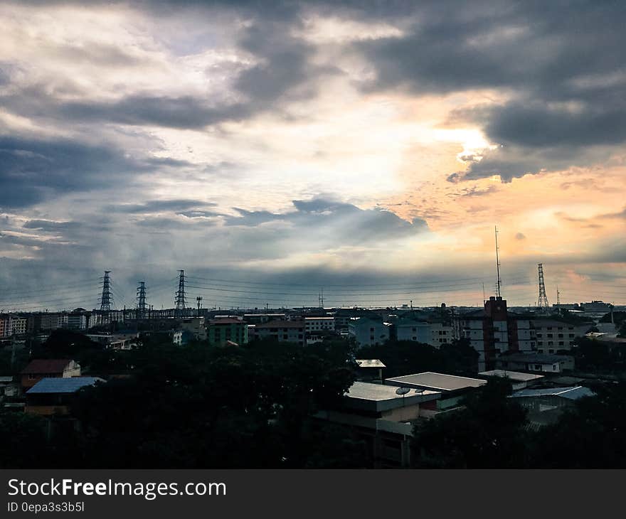 Blue skies at twilight over rooftops in urban skyline. Blue skies at twilight over rooftops in urban skyline.