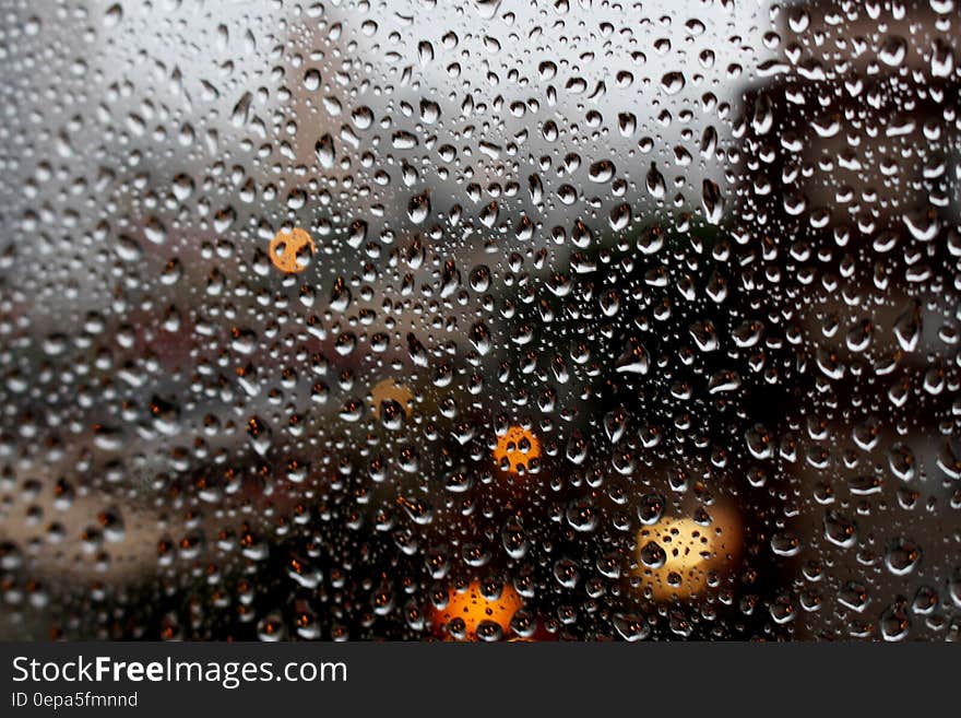 Full Frame Shot of Raindrops on Glass Window