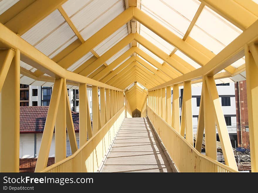 Covered wooden bridge walkway over urban setting. Covered wooden bridge walkway over urban setting.