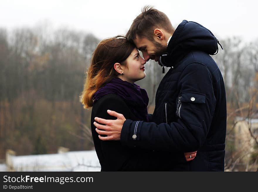 Young Couple on Woman during Winter