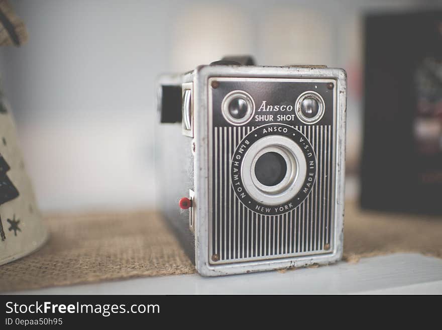 Vintage Ansco Shur Shot camera on burlap cloth.