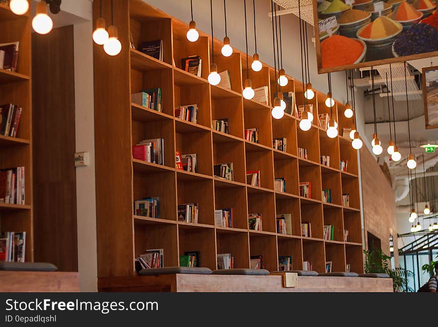 Interior of modern reading room with shelves of books and paintings. Interior of modern reading room with shelves of books and paintings.