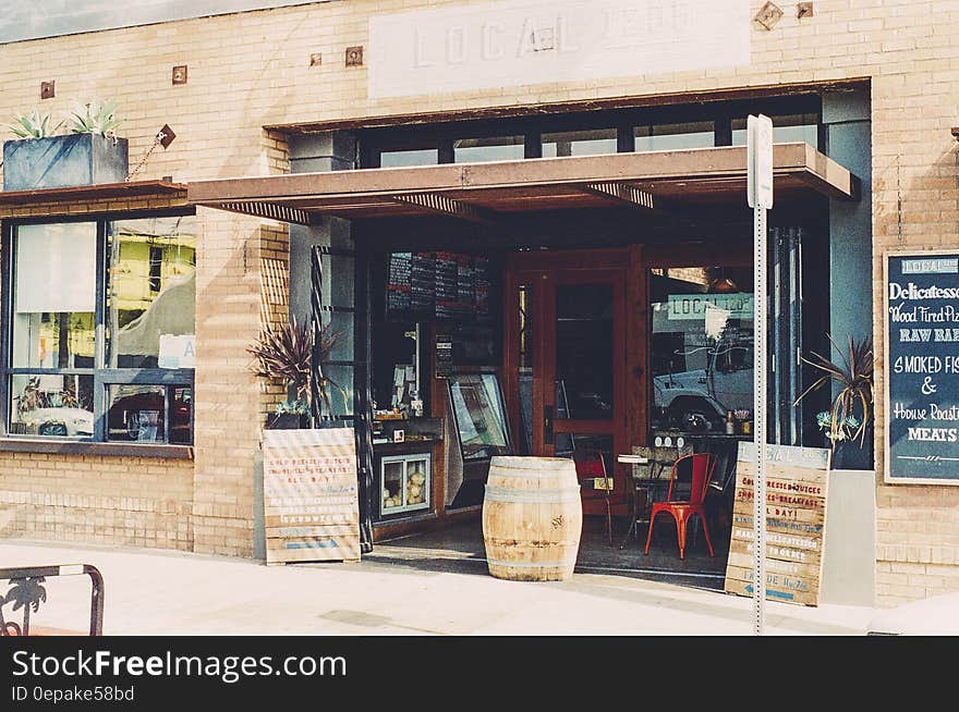 Front of restaurant in brick building on sunny day. Front of restaurant in brick building on sunny day.