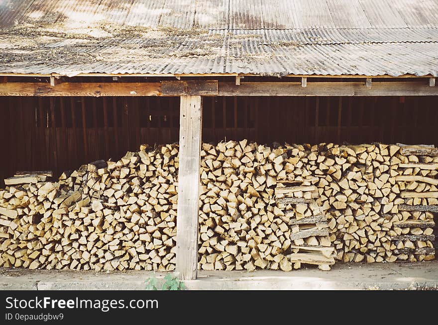 A huge stack of firewood in a stock. A huge stack of firewood in a stock.