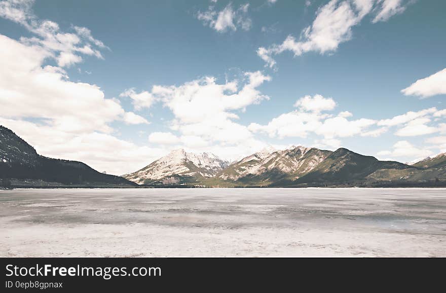 White Brown Mountain Under White Cloud and Blue Sky during Daytime